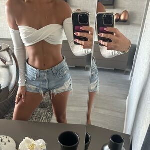 White long sleeve off the shoulder crop top with front twist